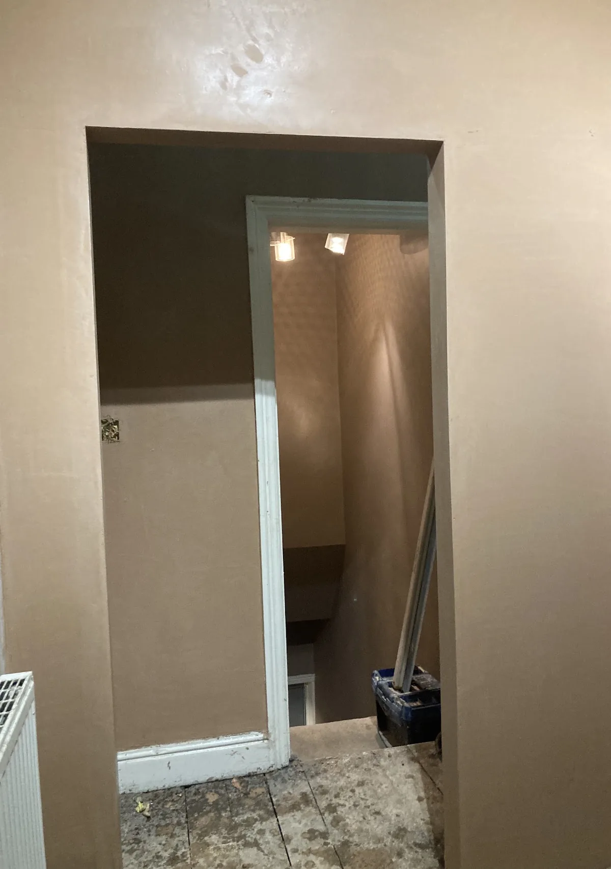 Hallway and doorway newly skimmed to a smooth finish, ready for decorating